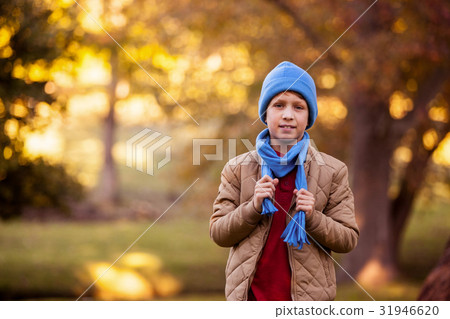 Portrait of boy holding scarf at aprk 31946620