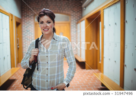 Mature student standing in the locker room Mature student standing in the locker room 31947496