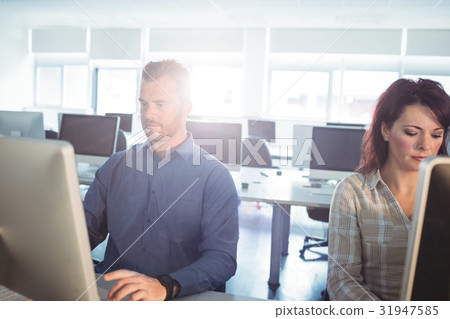 Mature students using computer Mature students using computer 31947585