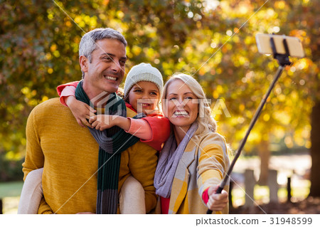 Smiling family taking selfie 31948599