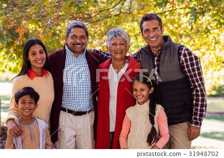 Portrait of multi-generation family standing at park 31948702