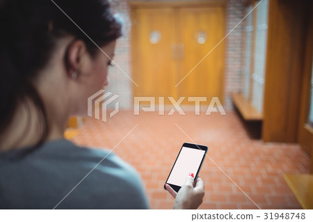 Mature student using mobile phone in the locker room 31948748