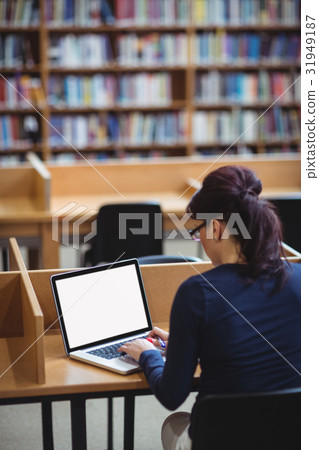 Mature student using laptop to help with studying 31949187