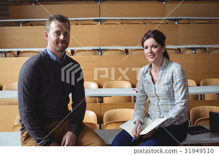 Mature students sitting on desk 31949510