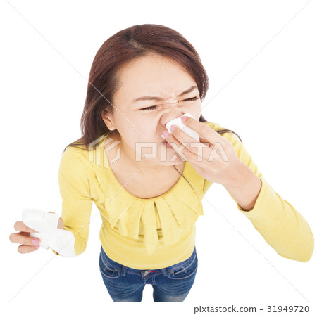 young woman is sneezing with painful face young woman is sneezing with painful face 31949720