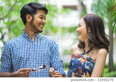 A beautiful couple is looking together and smiling 31950279