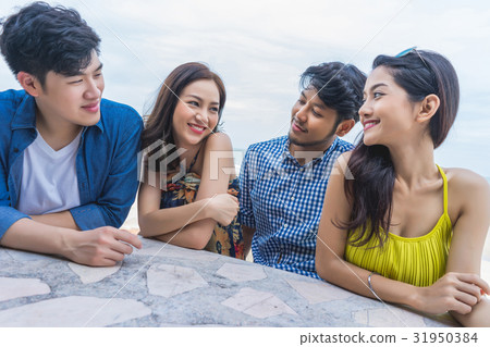 A photo of four people looking and smiling together 31950384
