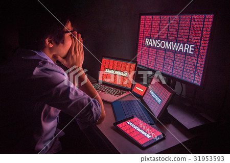 Young Asian male frustrated by ransomware cyber attack 31953593