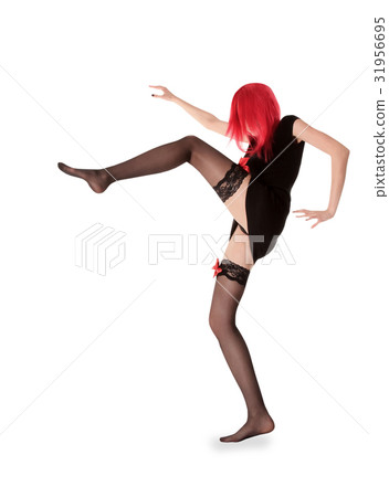 red hair woman in black stockings posing 31956695