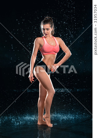 Young tanned fit woman with beautiful sporty 31957034