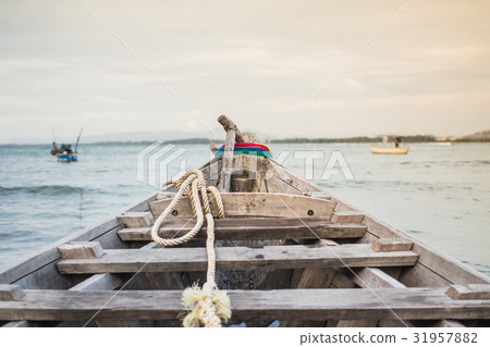 Thai boat sunset from Phuket Thailand Thai boat sunset from Phuket Thailand 31957882