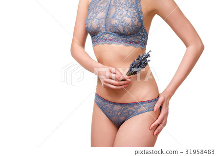 Slim, beautiful woman in lace lingerie holding 31958483