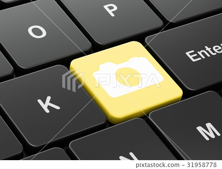 Travel concept: Photo Camera on computer keyboard 31958778
