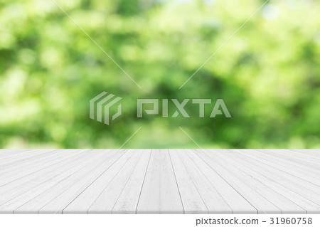 Empty white wooden table with nature background Empty white wooden table with nature background 31960758