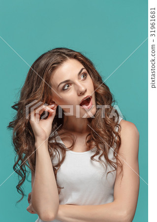 Portrait of young woman with shocked facial 31961681
