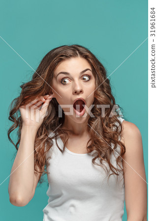 Portrait of young woman with shocked facial 31961684