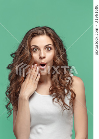 Portrait of young woman with shocked facial 31961686