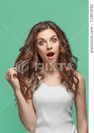 Portrait of young woman with shocked facial 31961698