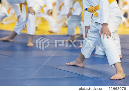 Children in kimono warming up on tatami on martial 31962076