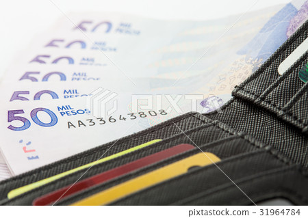 Black wallet filled with money and cards 31964784