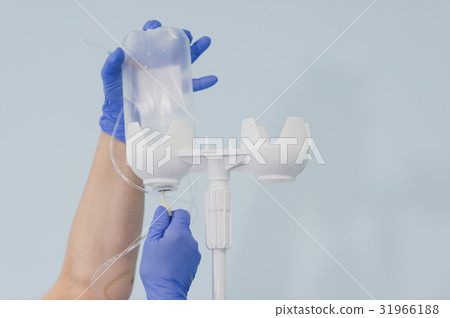 Doctor's hands and infusion drip in hospital on 31966188
