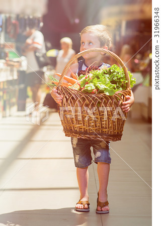 Boy with basket of fruit and vegetables Boy with basket of fruit and vegetables 31966348