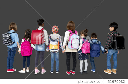 Rear view group of diverse kids standing in a row holdings hands 31970082