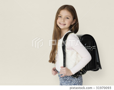 Young freckled girl carrying a backpack smiling portrait Young freckled girl carrying a backpack smiling portrait 31970093