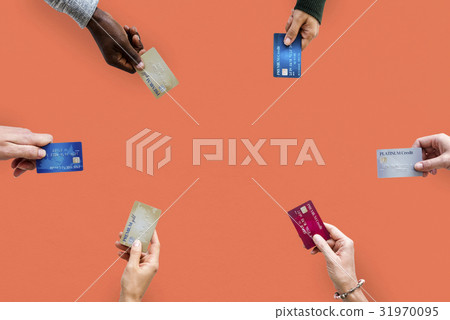 Group of hands holding credit card convenience life with copy space in aerial view Group of hands holding credit card convenience life with copy space in aerial view 31970095