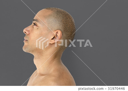 A skinhead guy is in a studio shoot 31970446