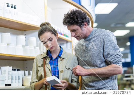 Couple checking medicines 31970784