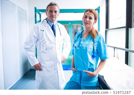 Portrait of doctor and surgeon standing in surgical room 31971287
