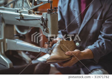 Shoemaker using sewing machine 31971782