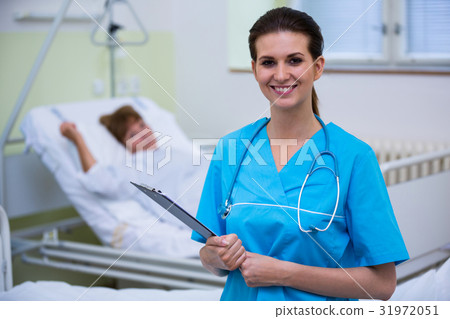 Nurse holding a clipboard 31972051