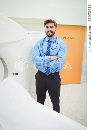 Portrait of doctor standing near mri scanner 31972418