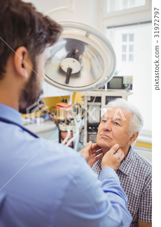 Doctor examining a patient Doctor examining a patient 31972797