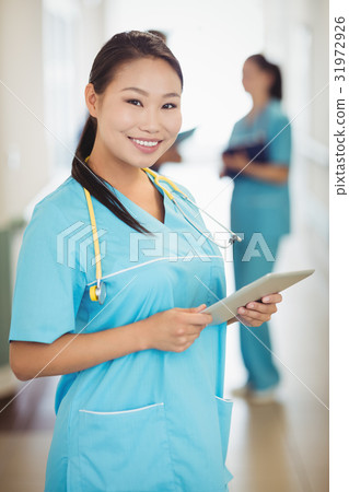 Nurse holding digital tablet 31972926