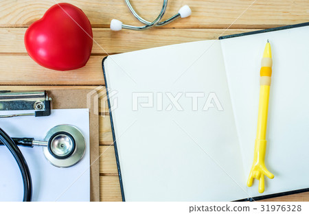 Red heart and a stethoscope, health and doctor Red heart and a stethoscope, health and doctor 31976328