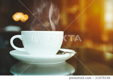 cup of coffee and smoke on table in cafe cup of coffee and smoke on table in cafe 31979146