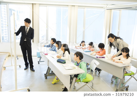 Teacher and elementary school student 31979210