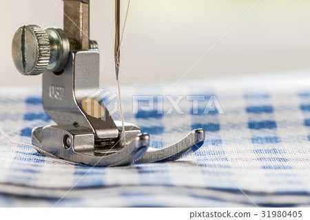Close-up of sewing machine and fabric Close-up of sewing machine and fabric 31980405