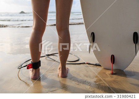 Young woman surfer with surfboard ready to surf 31980421