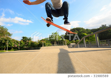 young skateboarder legs skateboarding at skatepark 31980569