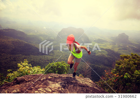 fitness woman trail runner running at mountain top fitness woman trail runner running at mountain top 31980662