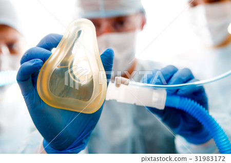 Photo of anesthesiologist with mask Photo of anesthesiologist with mask 31983172