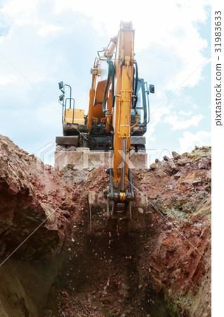 Excavator digging a pit. Excavator digging a pit. 31983633