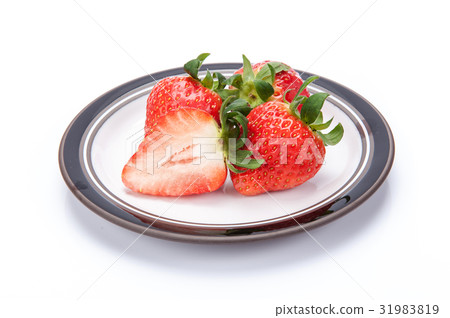 fresh garden strawberries on a white plate fresh garden strawberries on a white plate 31983819