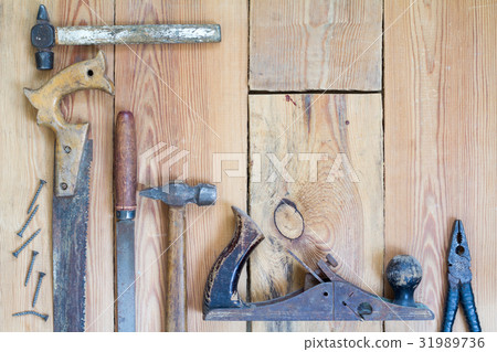 Carpentry tools on a wooden table top Carpentry tools on a wooden table top 31989736