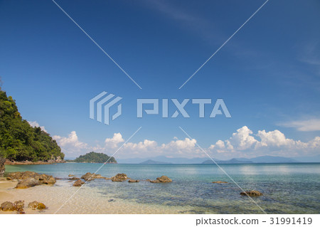tropical sea and beach with blue sky background tropical sea and beach with blue sky background 31991419