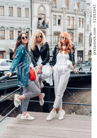 three beautiful girls on the street 31993843
